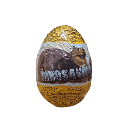 Display med 24 Jurassic World-chokladägg om 20g styck med dinosaurie-tema och överraskning, förpackade i en orange utställningsb