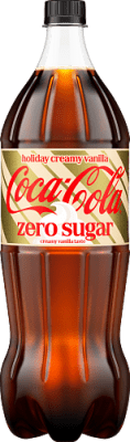 Zoom bild av Coca-Cola Zero Holiday Creamy Vanilla 1,5L PET-flaska med guldfärgad festlig förpackning mot vit bakgrund